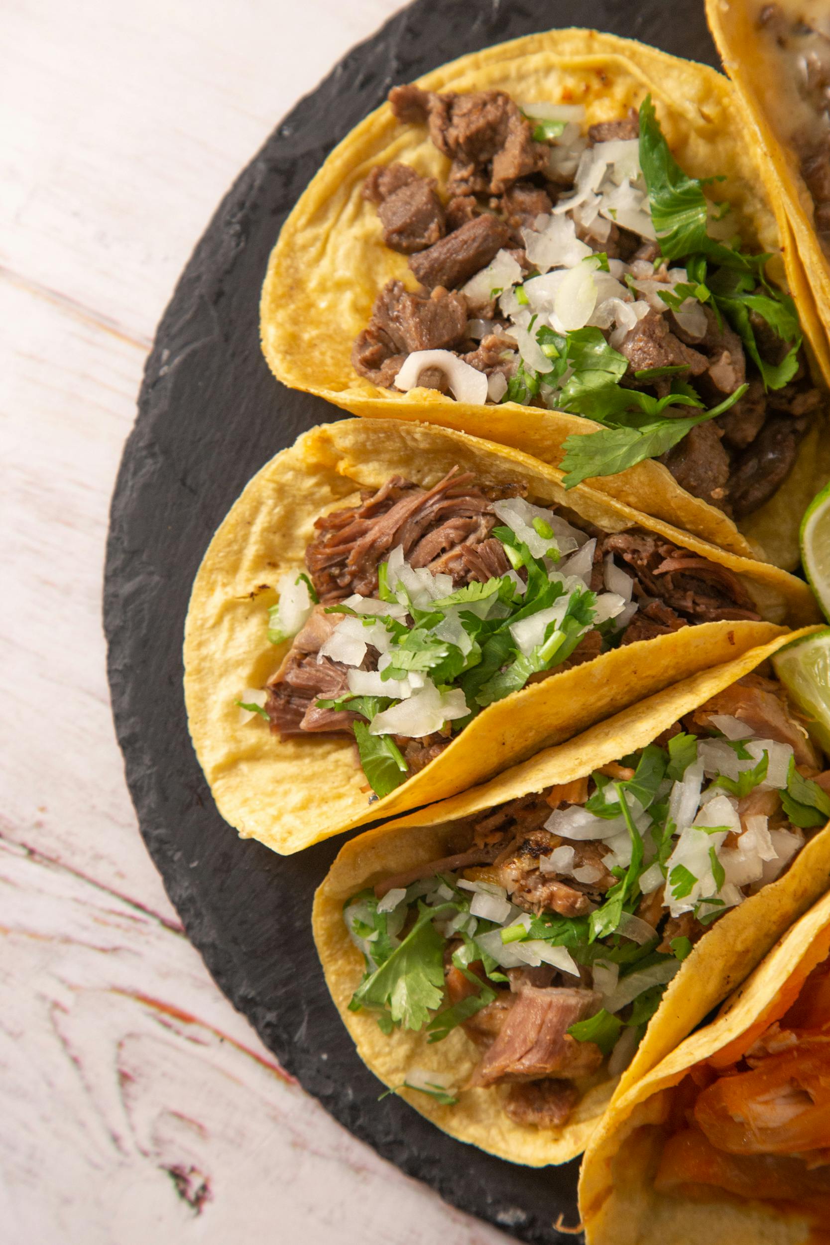 Savory Mexican tacos with fresh cilantro and onions, captured in Madrid.